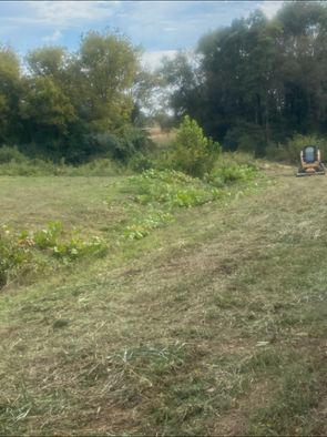 bushhogging rural land by Lawnscapes of the River Valley, photo shows equipment and progress